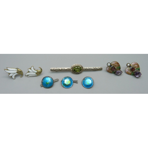 885 - Two pairs of enamelled earrings, a hammered  Arts and Crafts brooch and three enamelled buttons