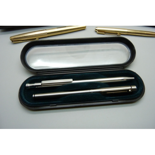 922 - A gold plated Sheaffer pen with 14ct gold nib, cased, two plated Parker pens and other pens