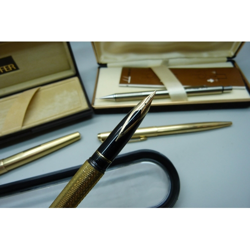 922 - A gold plated Sheaffer pen with 14ct gold nib, cased, two plated Parker pens and other pens