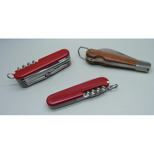 924 - Two Victorinox multi tool knives and one other knife