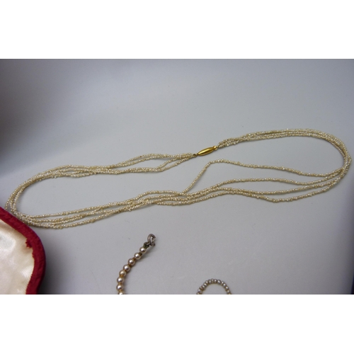 925 - Two seed pearl necklaces with 9ct gold fasteners and two faux pearl necklaces