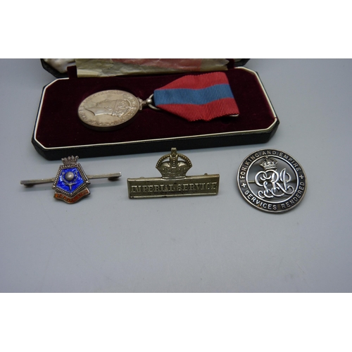 928 - A George VI Imperial Service Medal to Mabel Priscilla Purdy, a silver wound badge numbered 310763, s... 