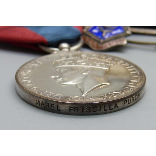 928 - A George VI Imperial Service Medal to Mabel Priscilla Purdy, a silver wound badge numbered 310763, s... 