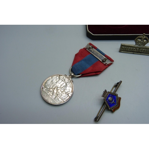 928 - A George VI Imperial Service Medal to Mabel Priscilla Purdy, a silver wound badge numbered 310763, s... 