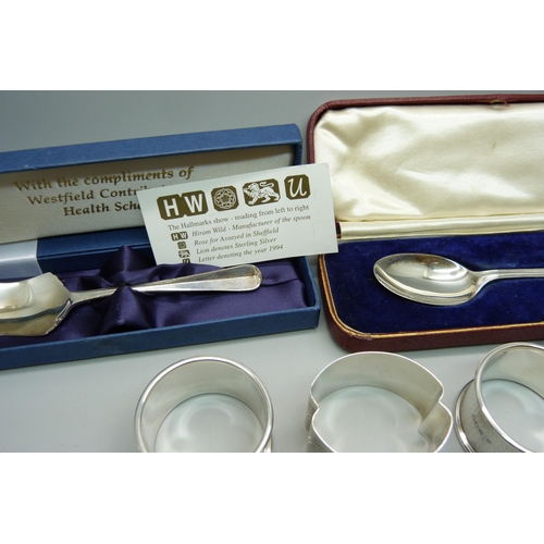 929 - A collection of silver items including napkin rings and spoons, 150g