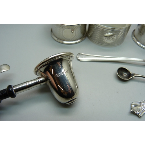 929 - A collection of silver items including napkin rings and spoons, 150g