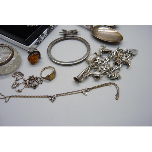 948 - A silver charm bracelet, bangle, pendants and chains, etc.