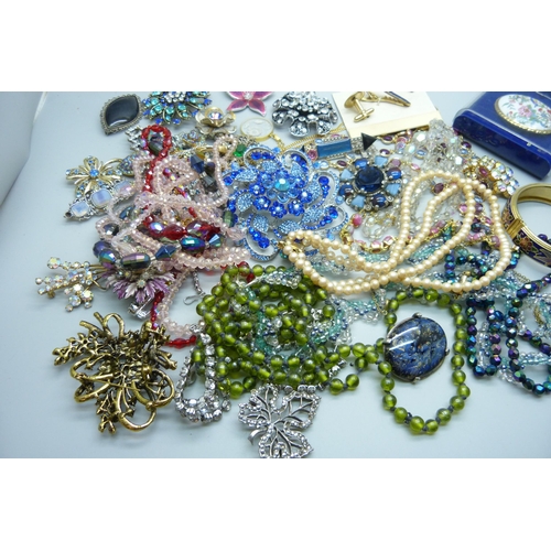 955 - Costume jewellery, paste set brooches, bead necklaces, etc.