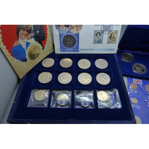 957 - A collection of coins, coin covers and a stamp cover, including two £5 coins, coin sets, etc.