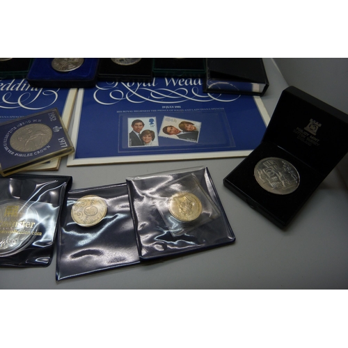 957 - A collection of coins, coin covers and a stamp cover, including two £5 coins, coin sets, etc.