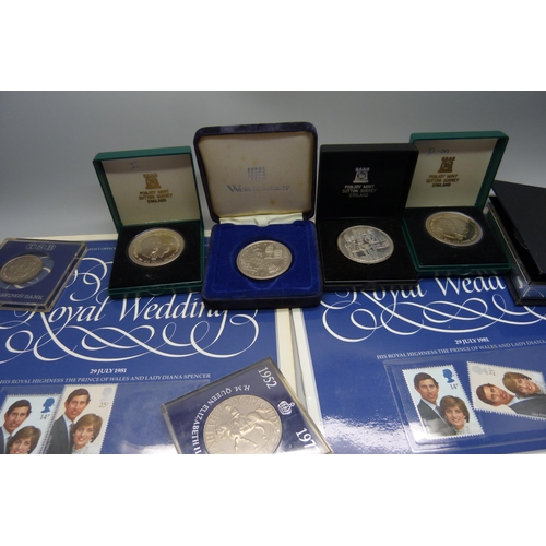 957 - A collection of coins, coin covers and a stamp cover, including two £5 coins, coin sets, etc.