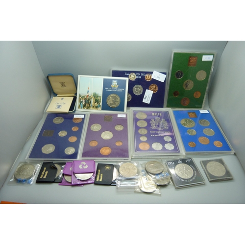 957 - A collection of coins, coin covers and a stamp cover, including two £5 coins, coin sets, etc.