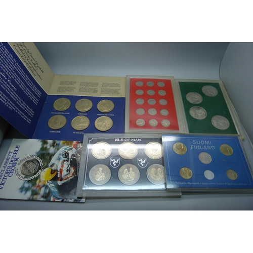 957 - A collection of coins, coin covers and a stamp cover, including two £5 coins, coin sets, etc.