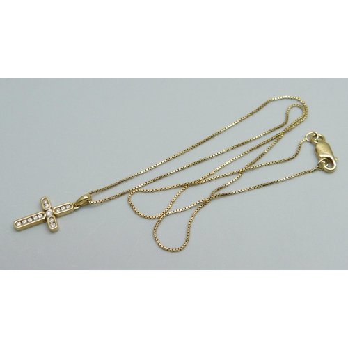 966 - An 18ct gold channel set diamond pendant on an 18ct gold chain, 3.1g, chain 39cm