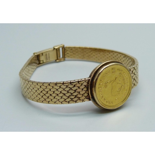 968 - A 9ct gold converted wristwatch strap set with a 1/10oz Krugerrand in casing, 23.5g