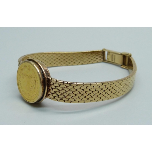 968 - A 9ct gold converted wristwatch strap set with a 1/10oz Krugerrand in casing, 23.5g