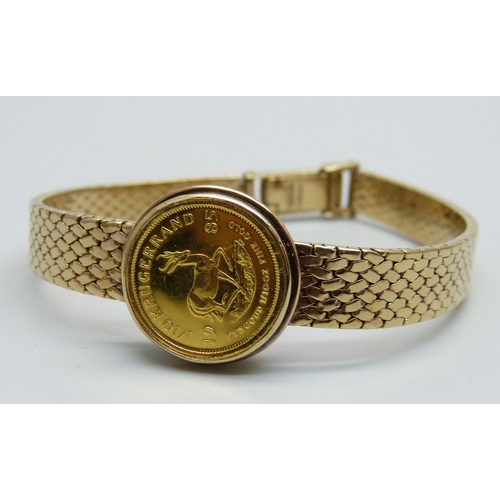 968 - A 9ct gold converted wristwatch strap set with a 1/10oz Krugerrand in casing, 23.5g