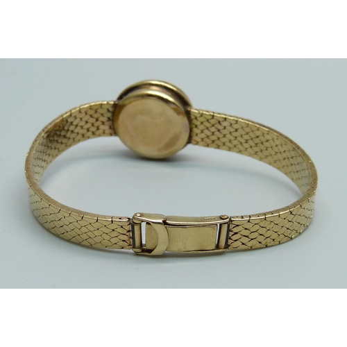 968 - A 9ct gold converted wristwatch strap set with a 1/10oz Krugerrand in casing, 23.5g