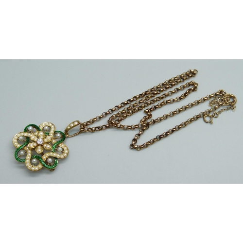 969 - A yellow metal pendant with guilloche green enamel border, half seed pearls and a central diamond, o... 