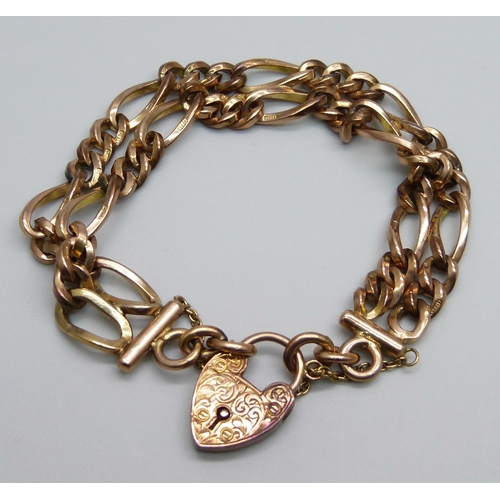 970 - A 9ct gold double row figaro chain padlock bracelet, 33.1g