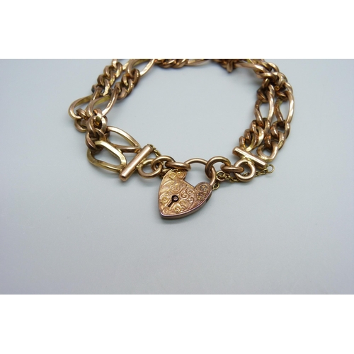 970 - A 9ct gold double row figaro chain padlock bracelet, 33.1g