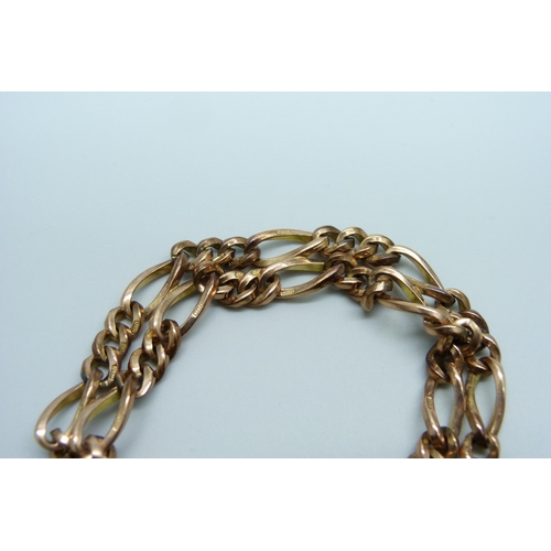 970 - A 9ct gold double row figaro chain padlock bracelet, 33.1g