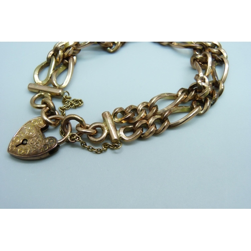 970 - A 9ct gold double row figaro chain padlock bracelet, 33.1g