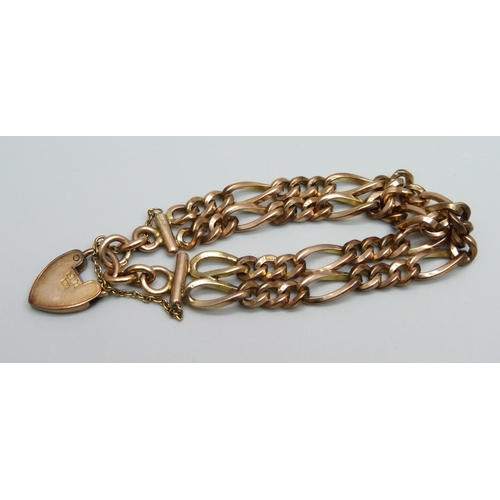 970 - A 9ct gold double row figaro chain padlock bracelet, 33.1g