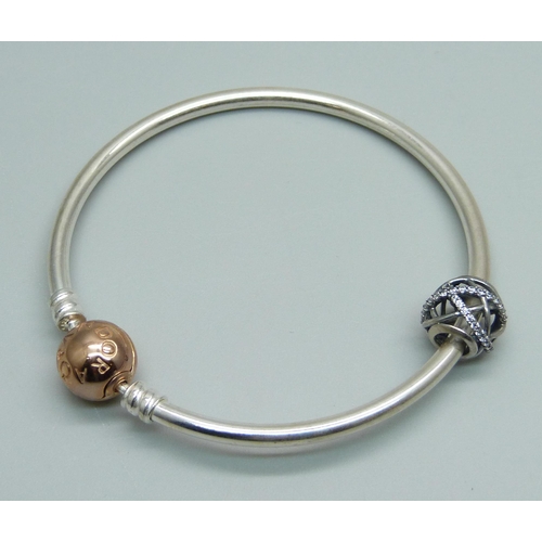 975 - A Pandora silver bracelet with a Pandora charm