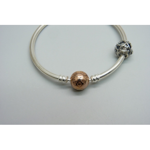 975 - A Pandora silver bracelet with a Pandora charm