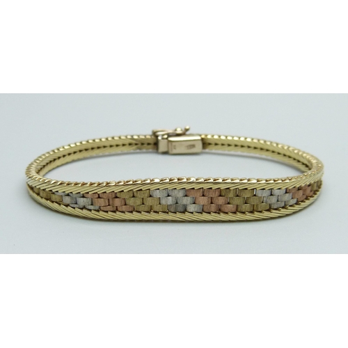 979 - A 9ct gold three tone bracelet, 13.1g