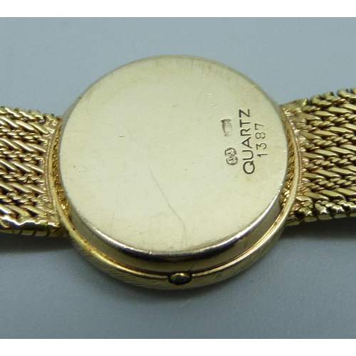 981 - A 9ct gold lady's Omega quartz wristwatch with a 9ct gold integrated strap, 22.9g