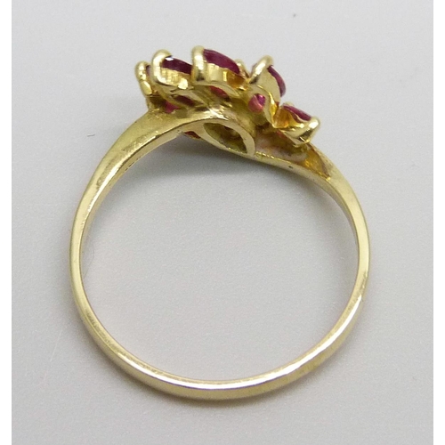 983 - An 18ct gold ruby and diamond ring, 3.1g, O