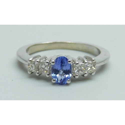 986 - An 18ct white gold tanzanite and princess cut diamond ring, 3.1g, N