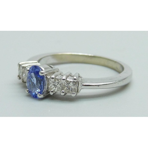 986 - An 18ct white gold tanzanite and princess cut diamond ring, 3.1g, N