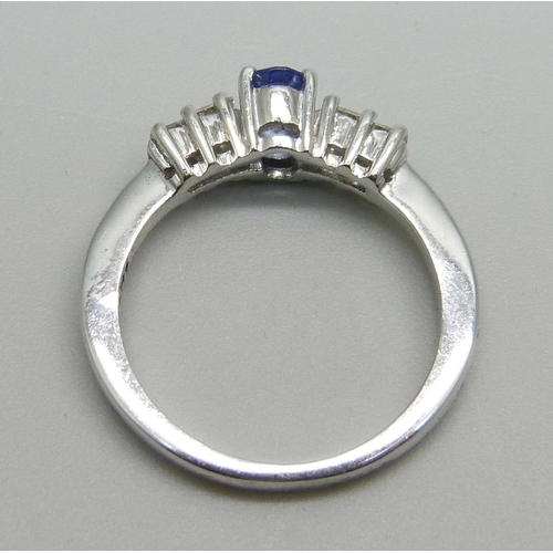 986 - An 18ct white gold tanzanite and princess cut diamond ring, 3.1g, N