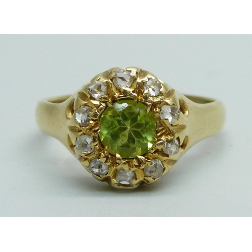 988 - An 18ct gold, peridot and diamond cluster ring, 3.9g, L/M