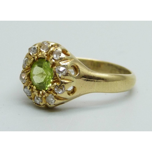 988 - An 18ct gold, peridot and diamond cluster ring, 3.9g, L/M