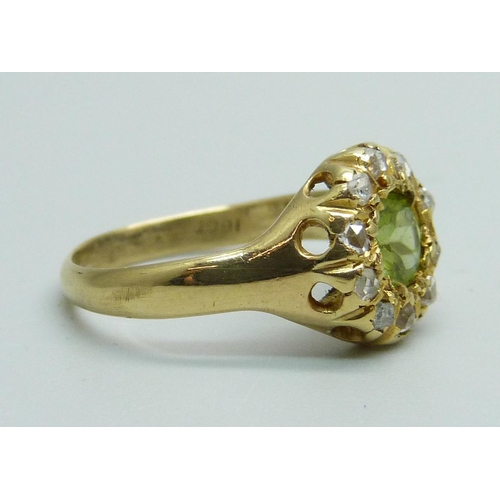 988 - An 18ct gold, peridot and diamond cluster ring, 3.9g, L/M