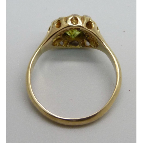 988 - An 18ct gold, peridot and diamond cluster ring, 3.9g, L/M