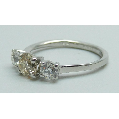 989 - A hallmarked platinum three stone diamond ring, total diamond weight 1.30 carats, (centre stone 0.75... 