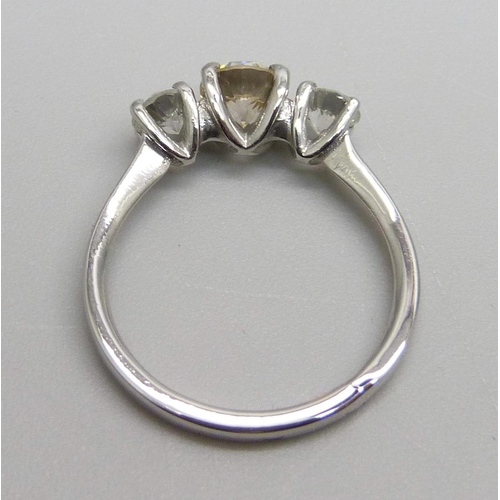 989 - A hallmarked platinum three stone diamond ring, total diamond weight 1.30 carats, (centre stone 0.75... 