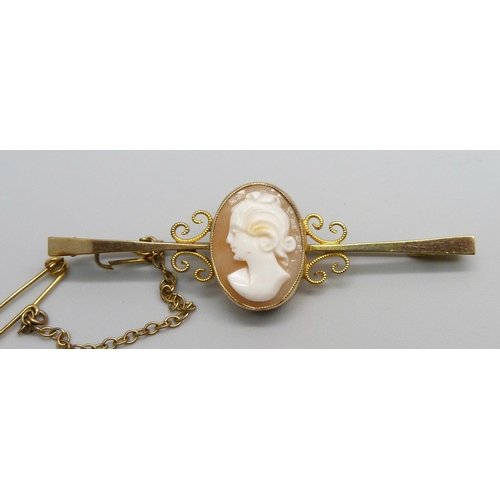 990 - A 9ct gold bar brooch set with a cameo, with metal pin, 4.3g