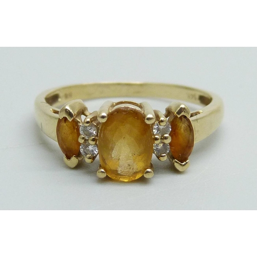 991 - A 14k gold three stone citrine and four stone diamond ring, 2.2g, N