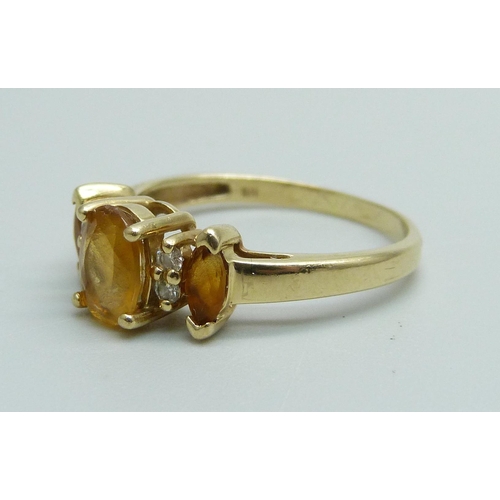 991 - A 14k gold three stone citrine and four stone diamond ring, 2.2g, N