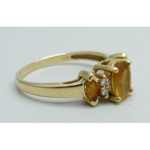 991 - A 14k gold three stone citrine and four stone diamond ring, 2.2g, N