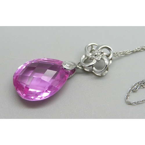 998 - A 10kt white gold, diamond and pink faceted stone pendant on a 10kt white gold chain, total weight 3... 