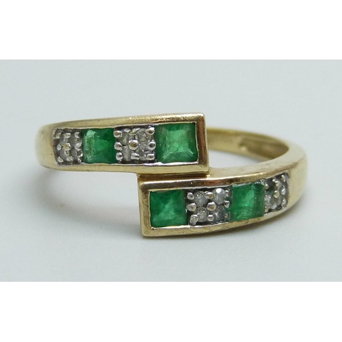 999 - A 9ct gold, emerald and diamond set ring, 2.6g, O