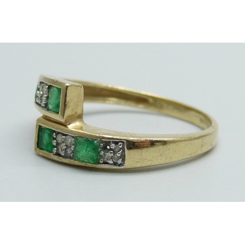 999 - A 9ct gold, emerald and diamond set ring, 2.6g, O