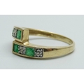 A 9ct gold, emerald and diamond set ring, 2.6g, O